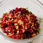 A fresh and colorful pomegranate beetroot salad with corn in a glass bowl indoors. - Photo by The Design Lady on Pexels